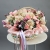 Композиция в корзине "Диодора" из французских роз Квиксенд, диантусов и кустовых пионовидных роз Бомбастик в Королеве
